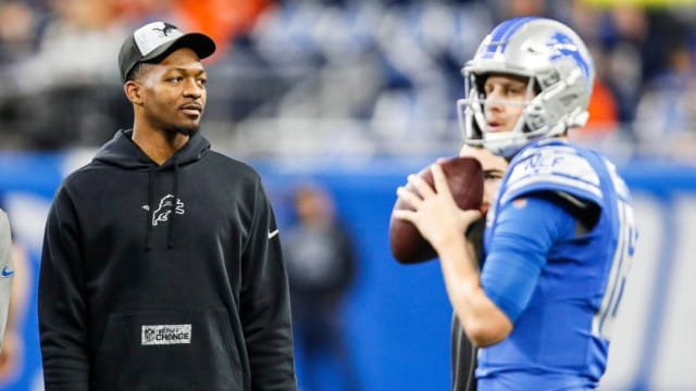 Detroit Lions quarterback Hendon Hooker watches Jared Goff
